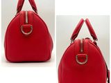 two pictures of a red purse with a metal handle