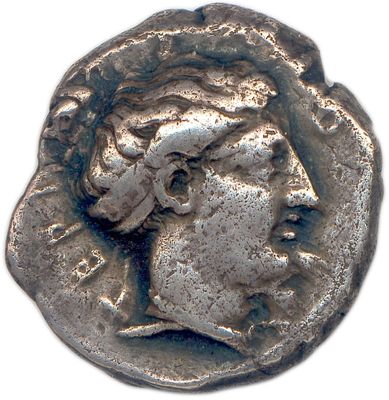 a close up of a coin with a woman ' s face on it