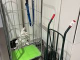 two hand trucks that are next to each other on the floor