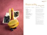 a spread for a magazine with a sandwich and blueberries