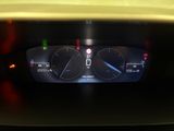 the dashboard of a car with a digital display on it