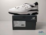 the new balance 995 is a white and black shoe with black accents