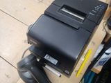 an image of a printer and a scanner on a table