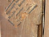 a picture of a piece of wood with a sign on it