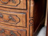 a small wooden table with a drawer on top of it