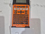 a calculator sitting on top of a piece of paper on a table