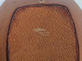 brown leather purse with a gold logo on the front