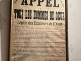 a framed poster on the wall of a room