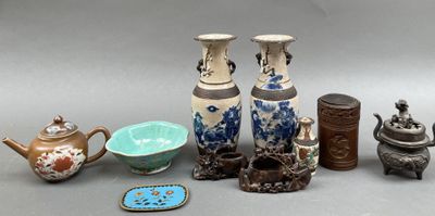 many different vases and bowls sitting on a table