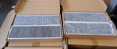 two boxes of air filters are stacked on top of each other