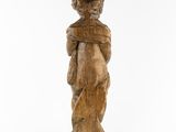 an image of a wooden statue of a woman holding a baby