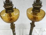 two lamps that are on display in a glass case