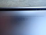 a laptop that is sitting on a wooden table