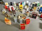 many different types of perfumes displayed on a table