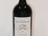 a bottle of wine that is sitting on a table