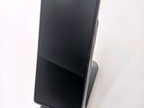 a cell phone that is sitting on top of a stand