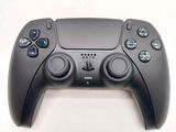 a close up of a video game controller on a table