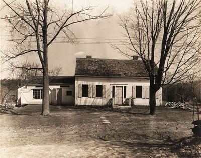 an old black and white photo of a house in the country