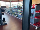 many shelves in the store that are filled with items
