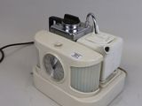a white camera that is sitting on top of a table