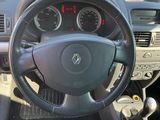 dashboard of a car with a steering wheel and dashboard gauges