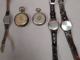 several different types of watches are displayed on a white surface
