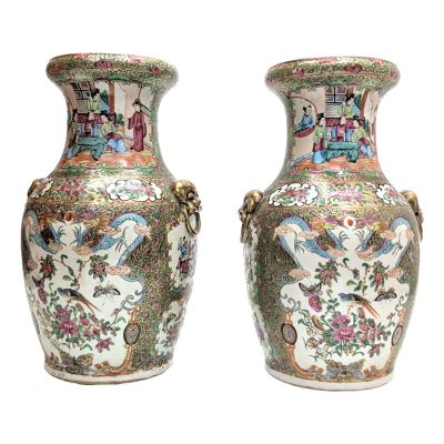 pair of chinese vases decorated with birds and flowers on a white background