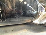 an image of a car being washed in a garage