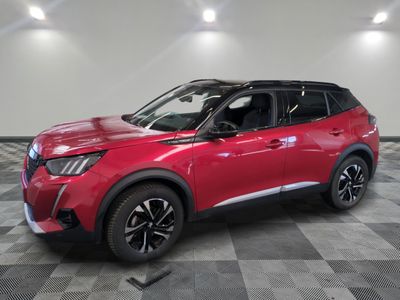 a red toyota c - hr suv parked on a checkered floor