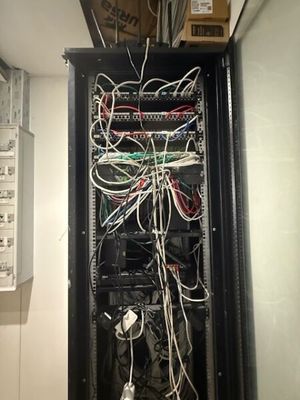 a black cabinet with a bunch of wires in it