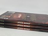 three star wars books stacked on top of each other on a table