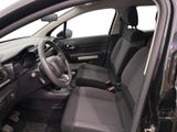 the interior of a car with a steering wheel and a dashboard