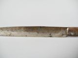 a large knife that is sitting on a table
