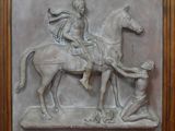 statue représentant un homme à cheval avec un autre homme à cheval