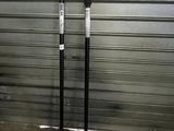 two poles that are standing next to each other in front of a garage door