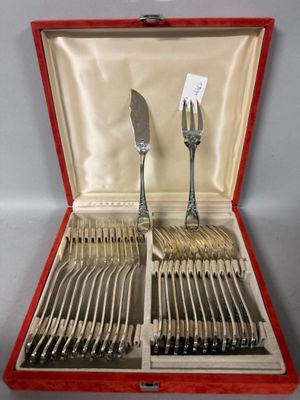 a red case with silverware in it on a table
