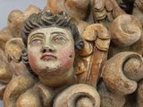 a close up of a statue of a woman with a face