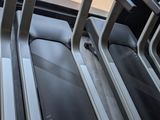 three treads on the tread machine in the gym