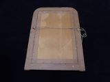 a picture of a piece of wood with a wire on it