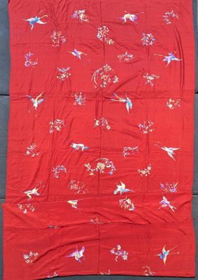 an old chinese red and white silk quilt with birds and flowers
