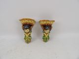 pair of ceramic figurines of a woman with a basket on her head