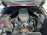 a picture of a car engine with its hood open