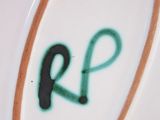 a picture of a plate with the letter r on it