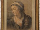 painting of a woman in a turban by a brick wall