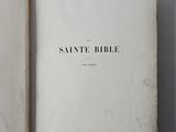 a close up of a book open on a white surface