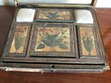 a wooden box that has a picture of flowers on it