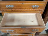 two wooden drawers that are open on top of each other