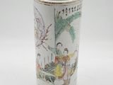 a white cup with a picture of a woman and a bird on it