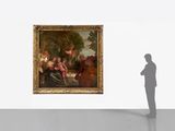 a man that is standing in front of a painting