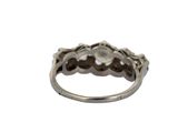 an image of a silver ring with a diamond in the middle